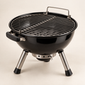 Concept image of a compact black tabletop charcoal grill